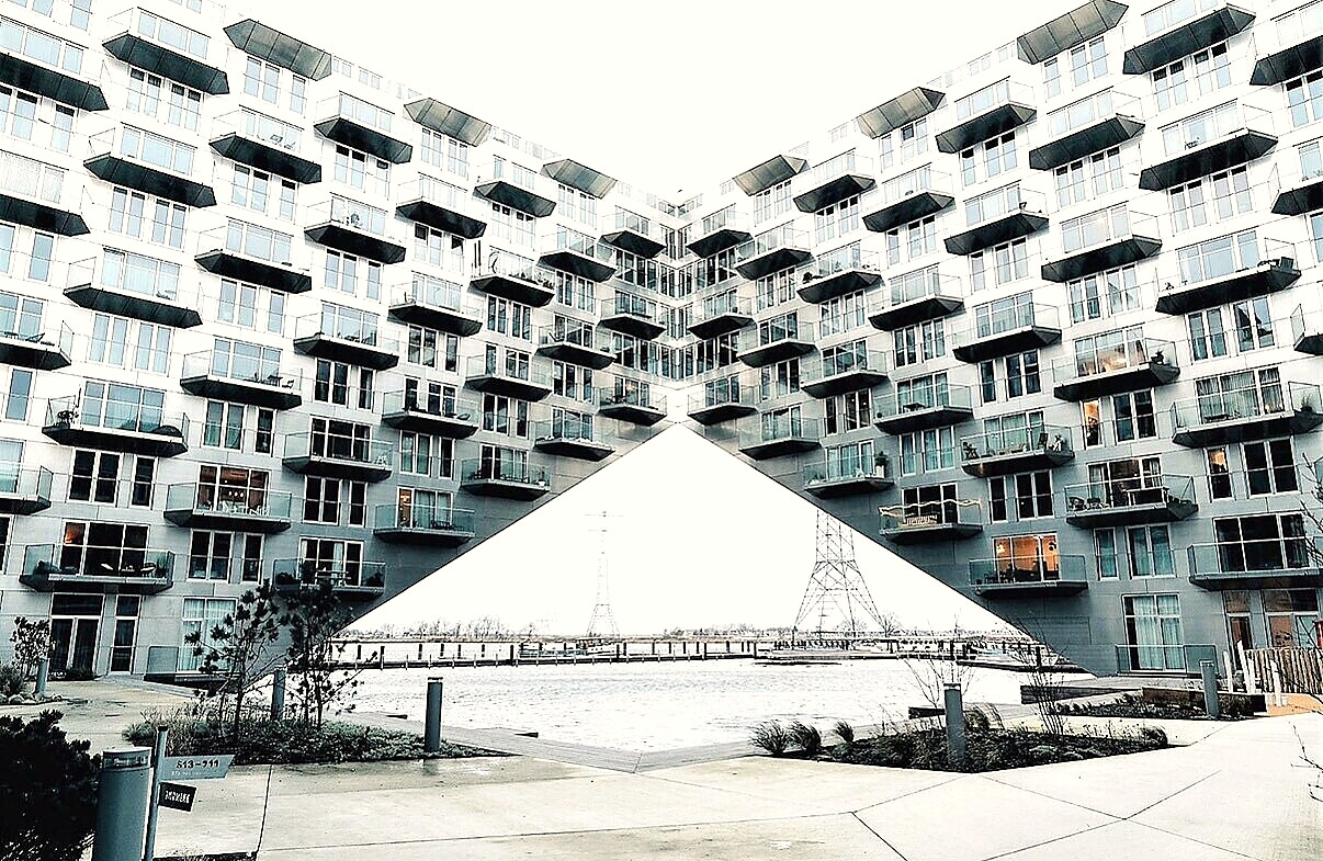 The apartment building’s shared courtyard opening onto the water