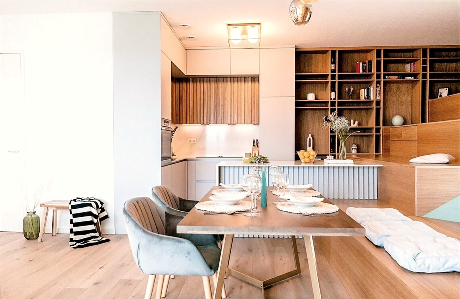 The same kitchen staged for the first photos, with a set dining table